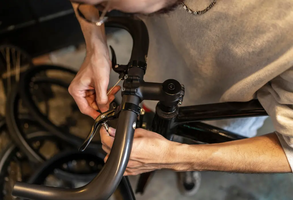 Image of person repairing bike